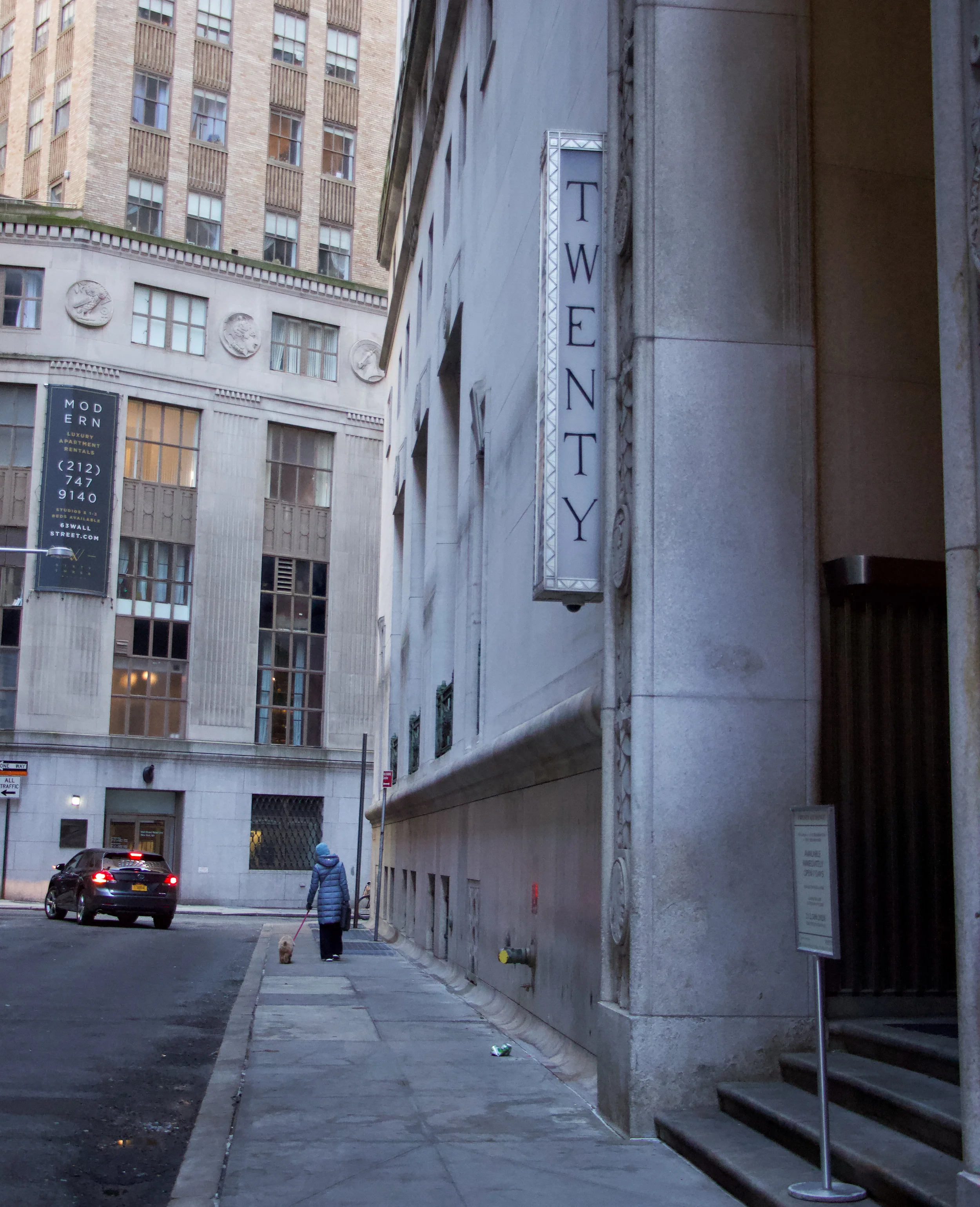 Woman walks her dog along Exchange Place. || Photo credit to Gabriela Kressley.