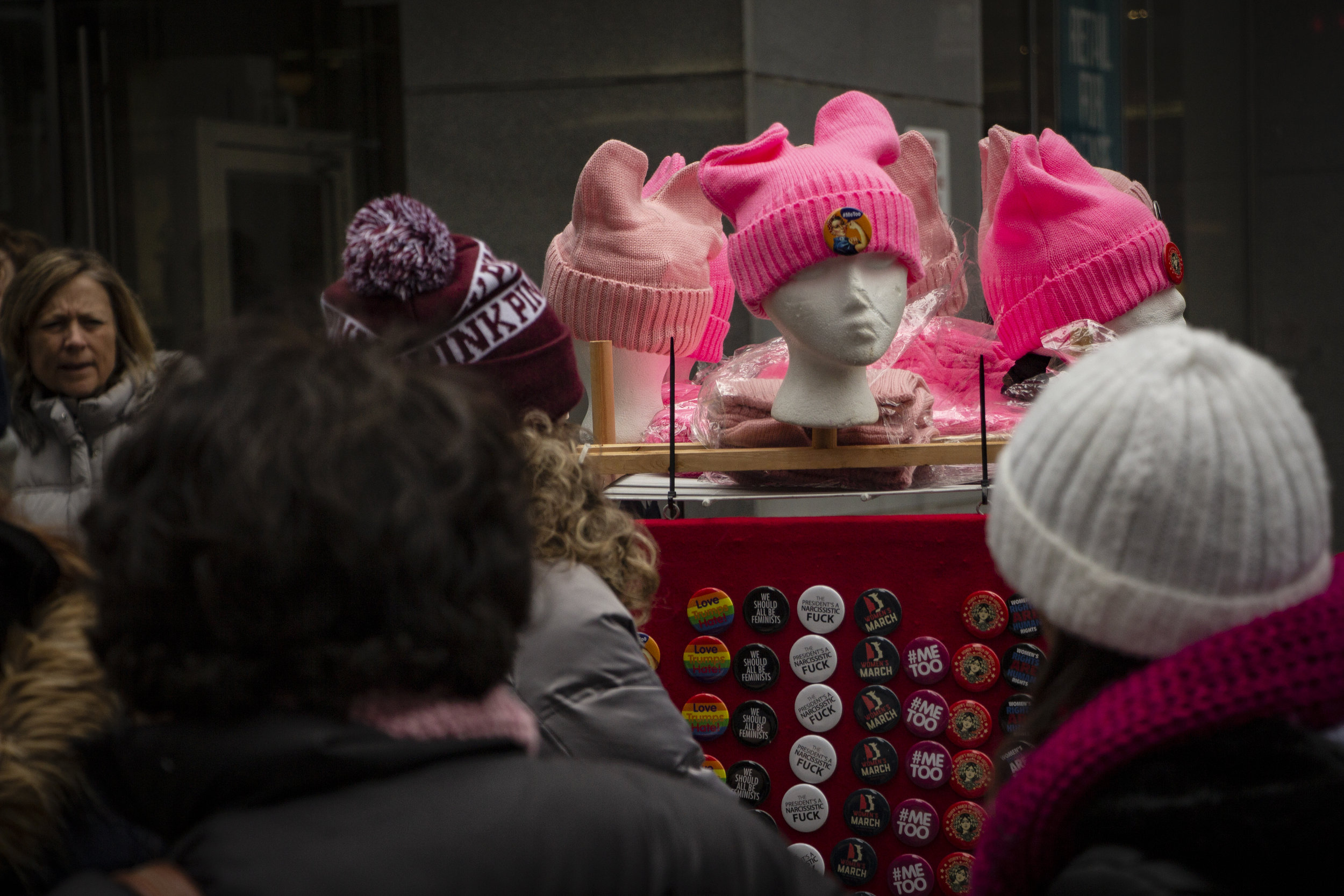 A stand of Women’s March gear on 6th Avenue in NYC. || Photo credit to Bernadette Berdychowski