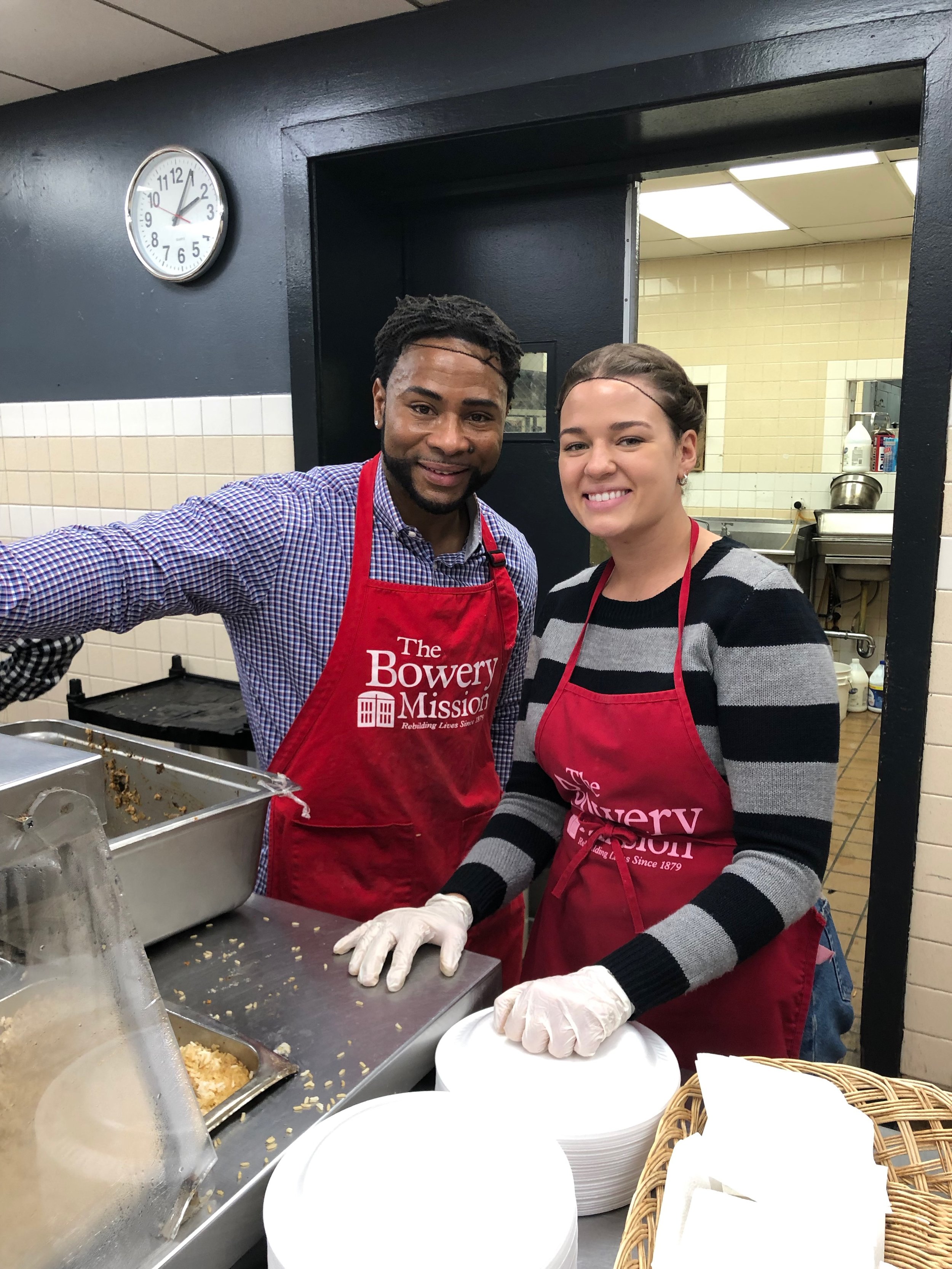 John Northcutt and Victoria Bevill smile after finishing their lunchtime service at The Bowery Mission. || Photo credit to Serena Tuomi.