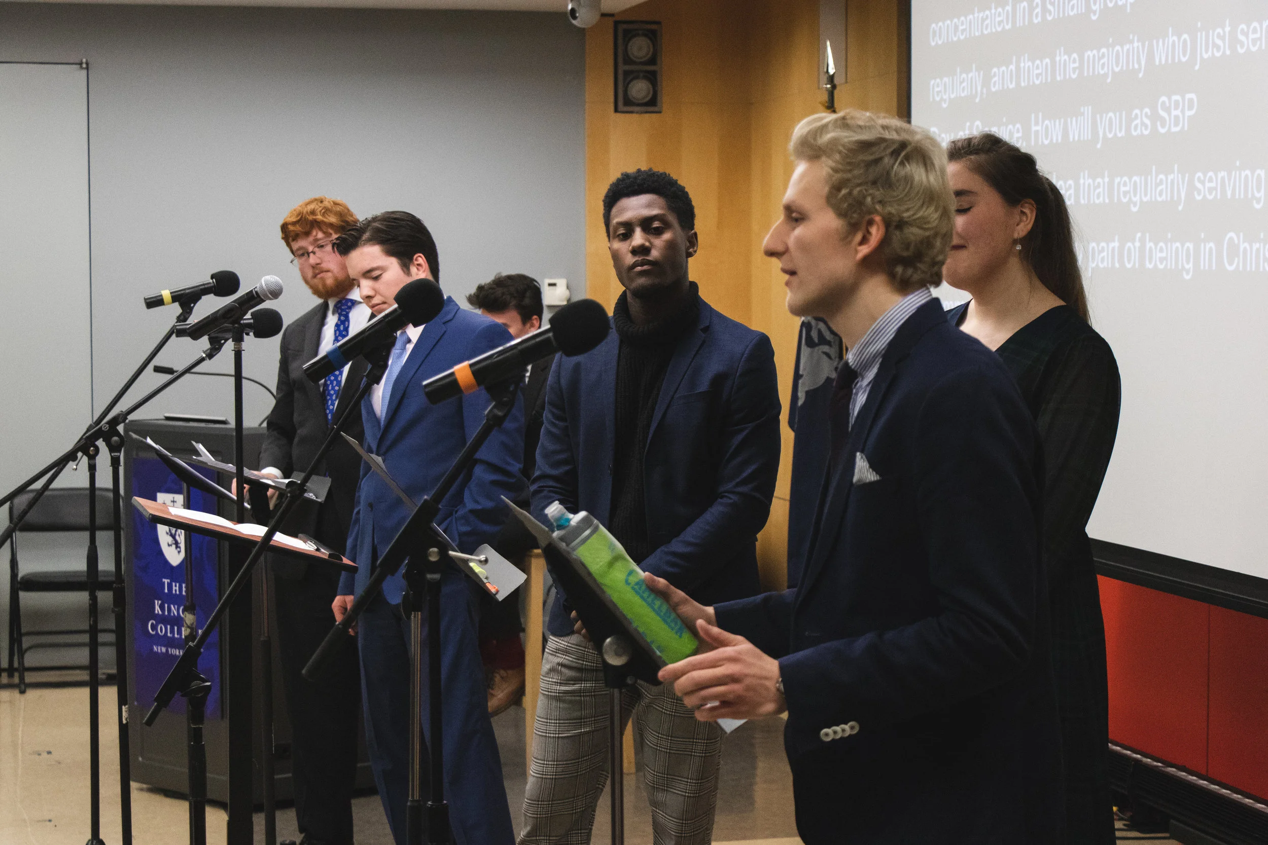 SBP candidates line up during the debate || Photo Credit to Brent Buterbaugh