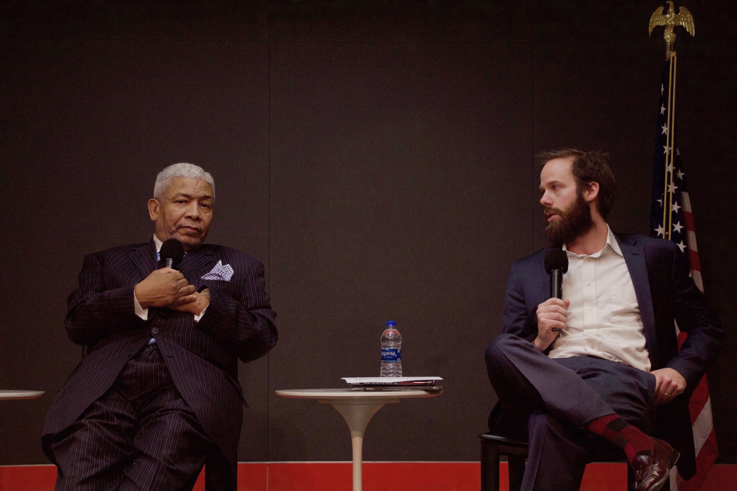 Reverend Eugene Rivers and Dr. Paul Mueller sit on a panel at the “Difficult Discussions” lecture on Feb. 21. || Photo credit to Brendan Bell.