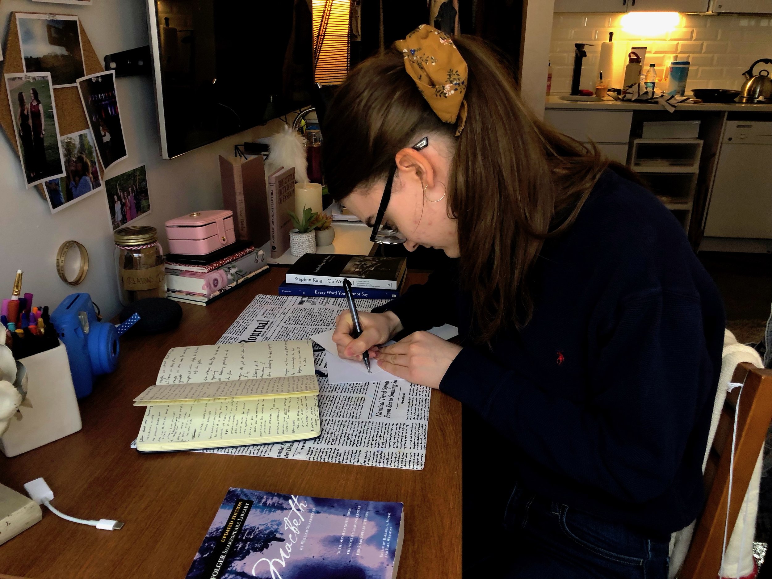 Ellen Coy writing a letter. || Photo credit to Lauren Bannister.