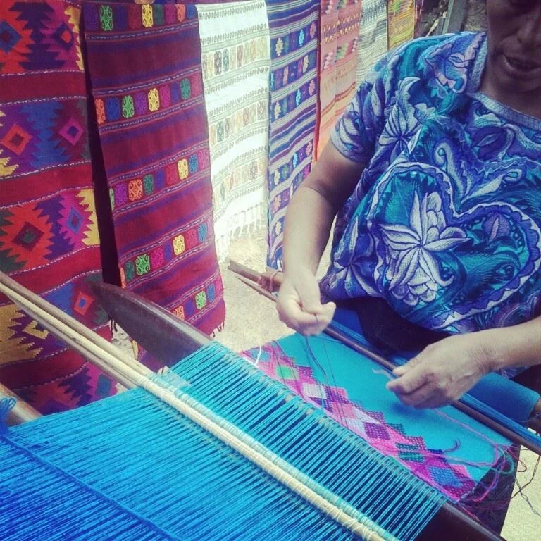 Weaver using backstrap loom. Chiapas, Mexico. Photo by Alyce Ornella