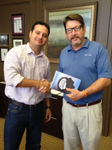 Carlos Giraldo recieves book from Tim Mc.9.10.14.jpg