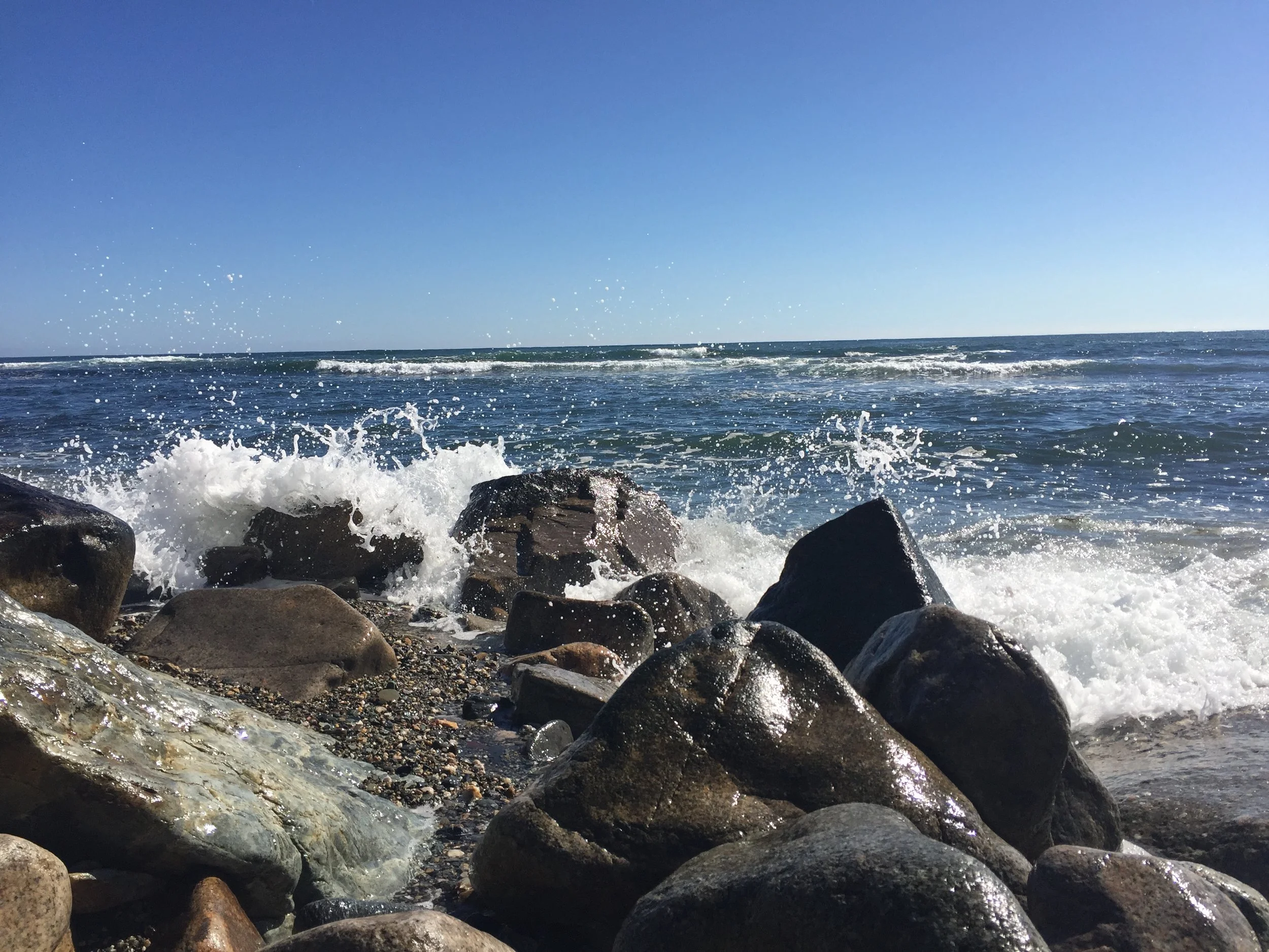 waves crashing over rocks.JPG