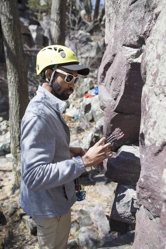 Gordon from North Wall Climbing Gym in Crystal Lake, IL considering his #1 Camalot.