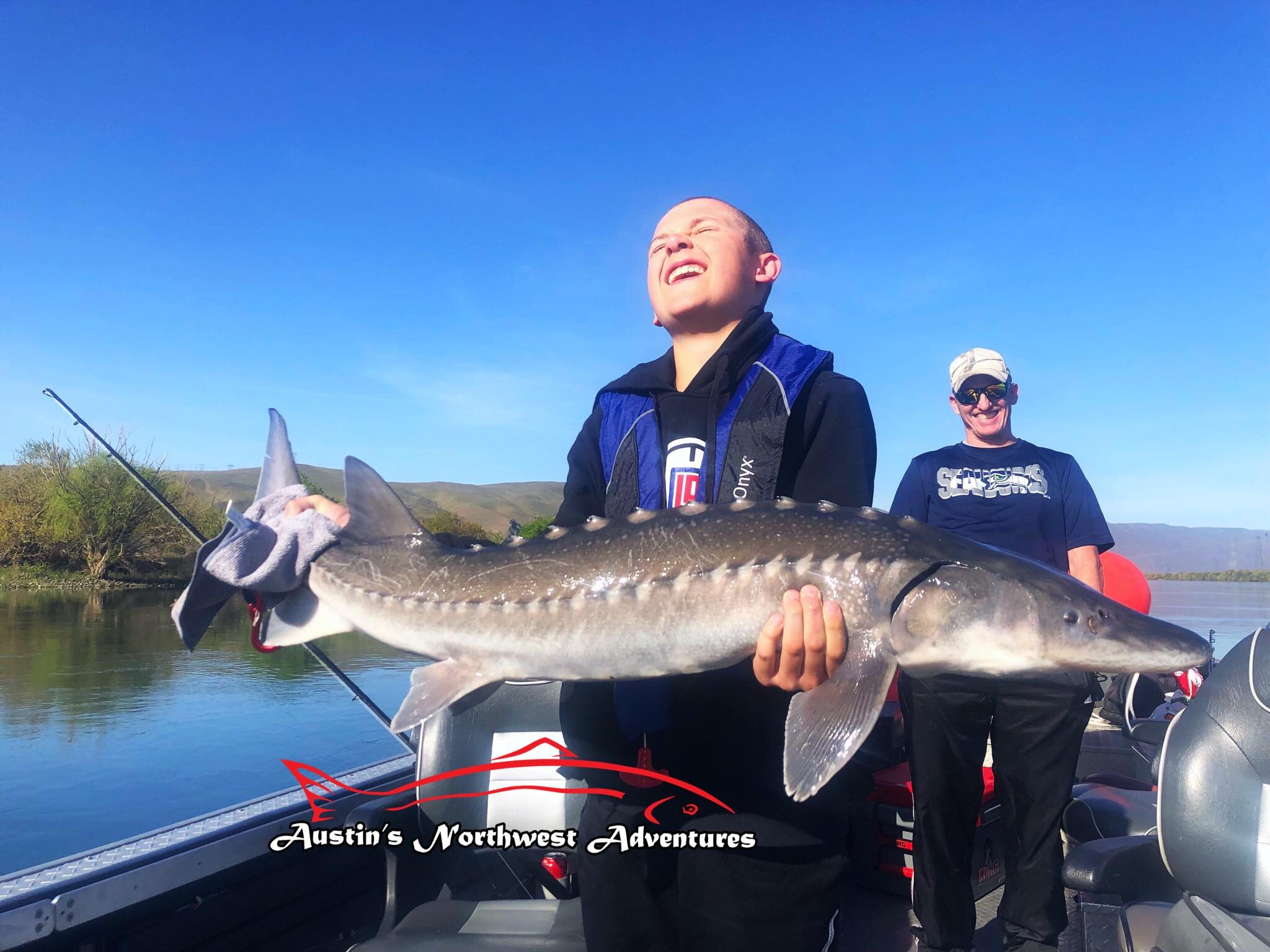 youth angler with sturgeon austin moser.jpg