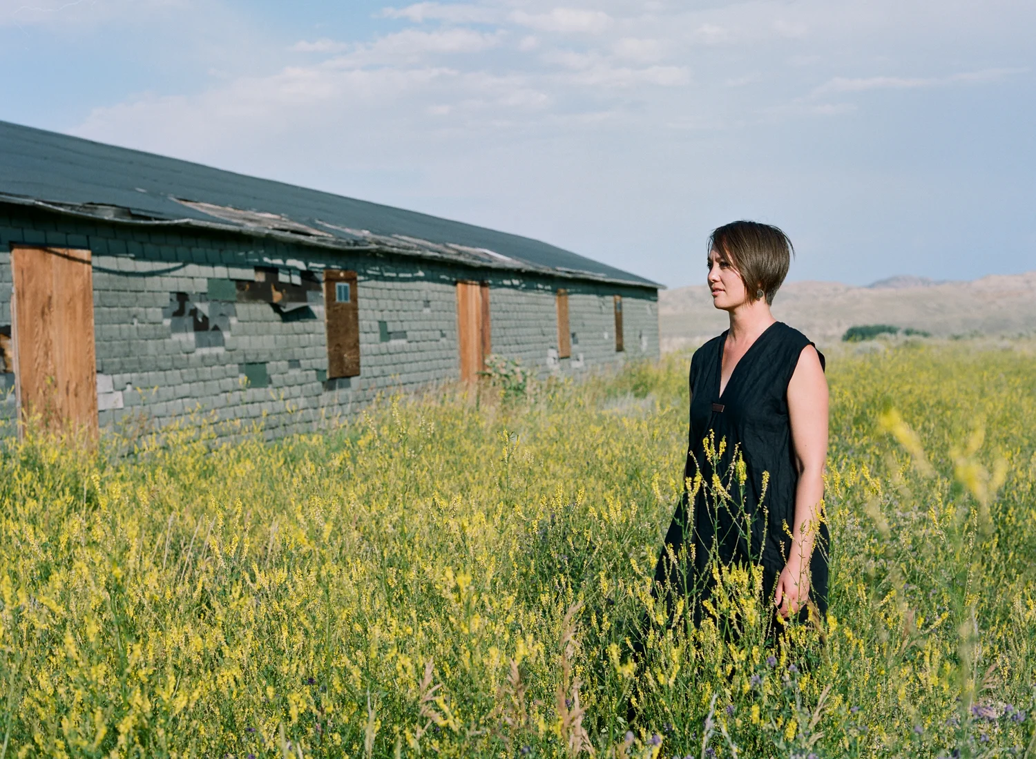 Aura Newlin at the Heart Mountain confinement site. During WWII, it became one of ten "relocation centers" where nearly 120,000 Japanese American immigrants and their American-born children (including her relatives) were incarcerated.
