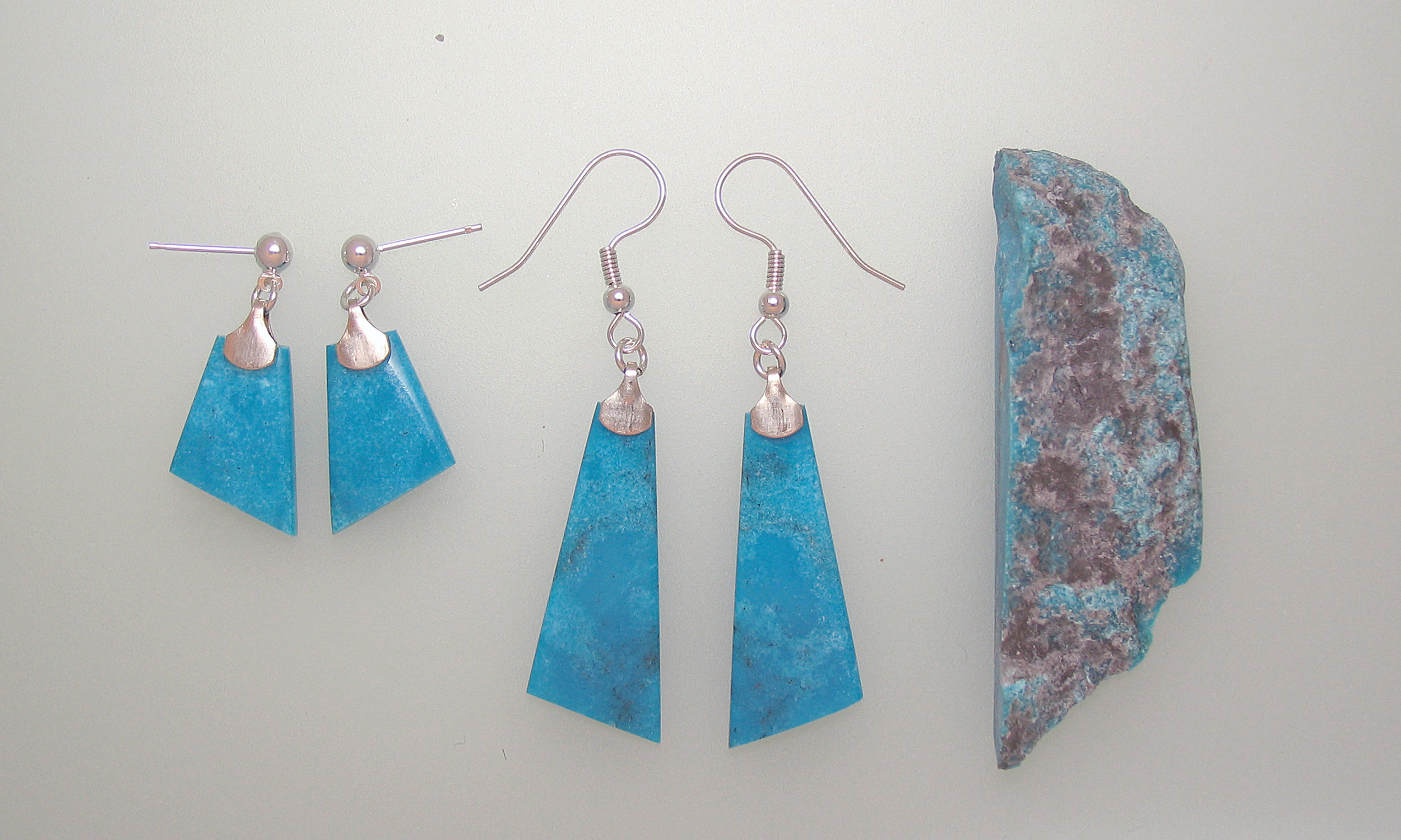 And here is an example of the before and after showing the rough native material and two pair of earrings created from that piece.