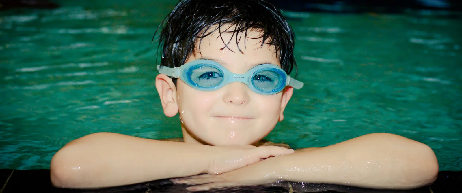 A child enjoying Osprey swimming pool facilities