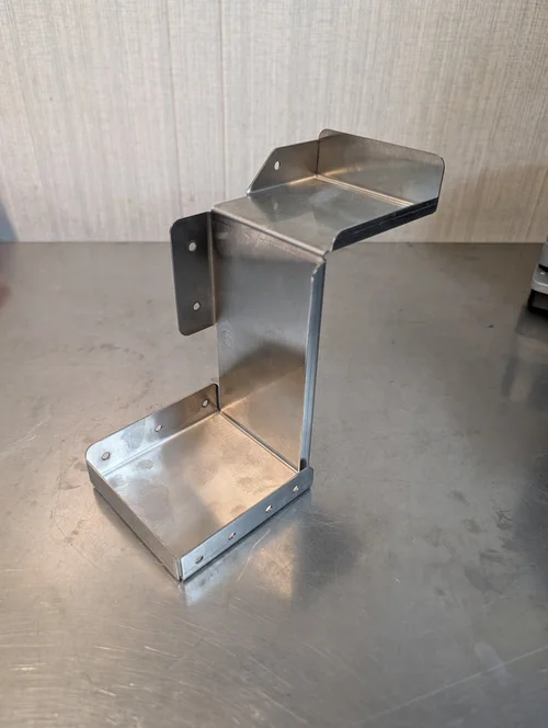 Formed stainless steel bracket with mounting holes