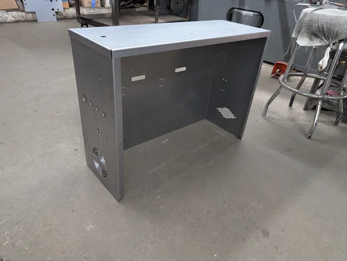 Formed steel console enclosure with punched vents and holes