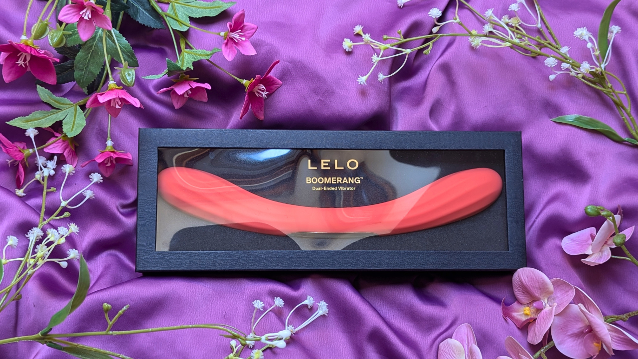LELO Boomerang double ended vibrator in coral red in black and gold packaging