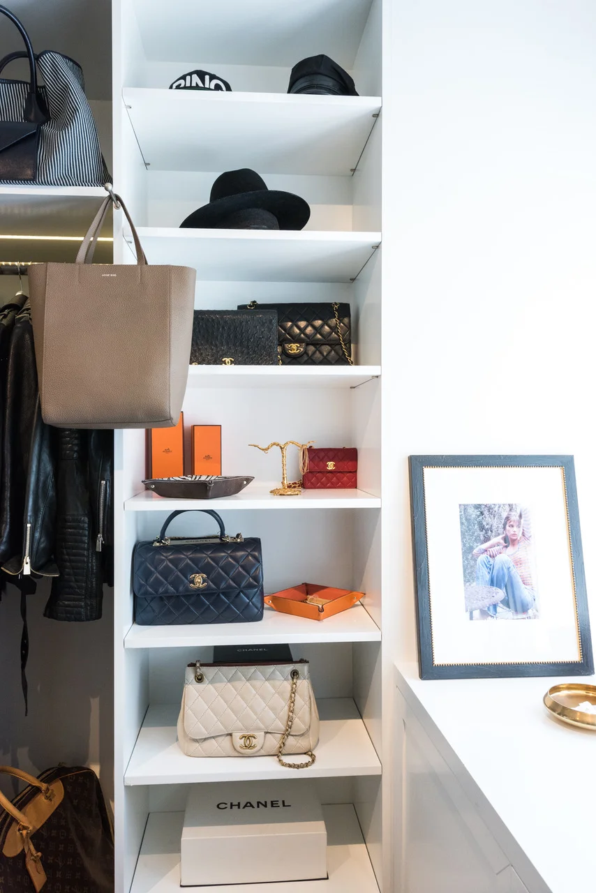 HOW DO YOU ORGANIZE YOUR CLOSET? "Not really by season, more by item. Sweaters, t-shirts, denim, leather and color..."
