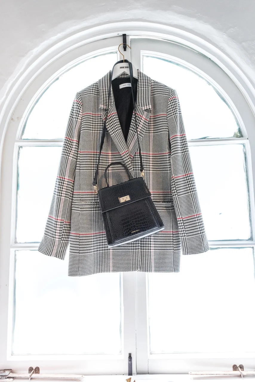 Do YOU MERCHANDISE ANY AREAS OF YOUR CLOSET? "Ha, definitely! It's pretty much all merchandised. There's leather and denim, bags, and boots, lingerie. They've all got their own special section and spotlight." 