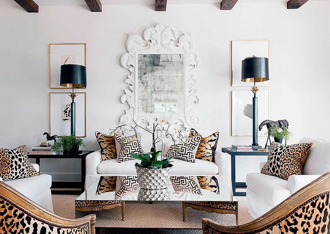 leopard and tiger print throw pillows bring an otherwise traditional living space to life!