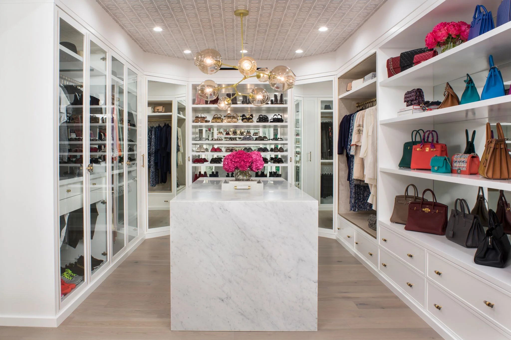 a creative way to tie together a design - put the pattern on the ceiling! This makes for a more boutique experience in the closet, and is a playful way to add a little personality to your space.
