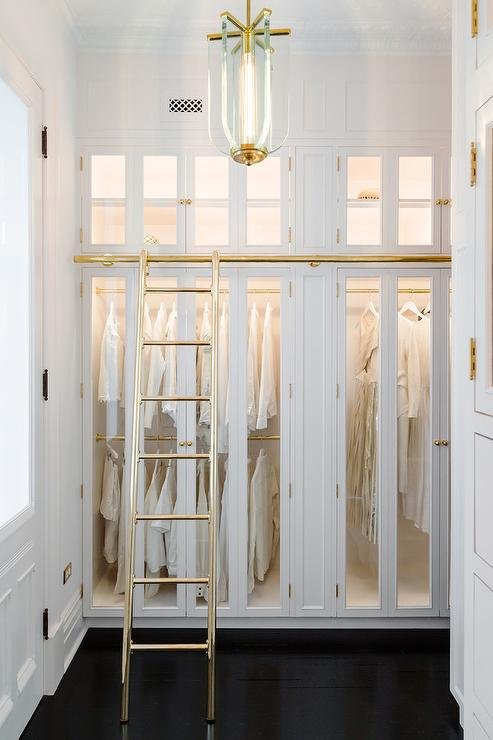 custom-walk-in-closet-with-gold-ladder-on-rails.jpg