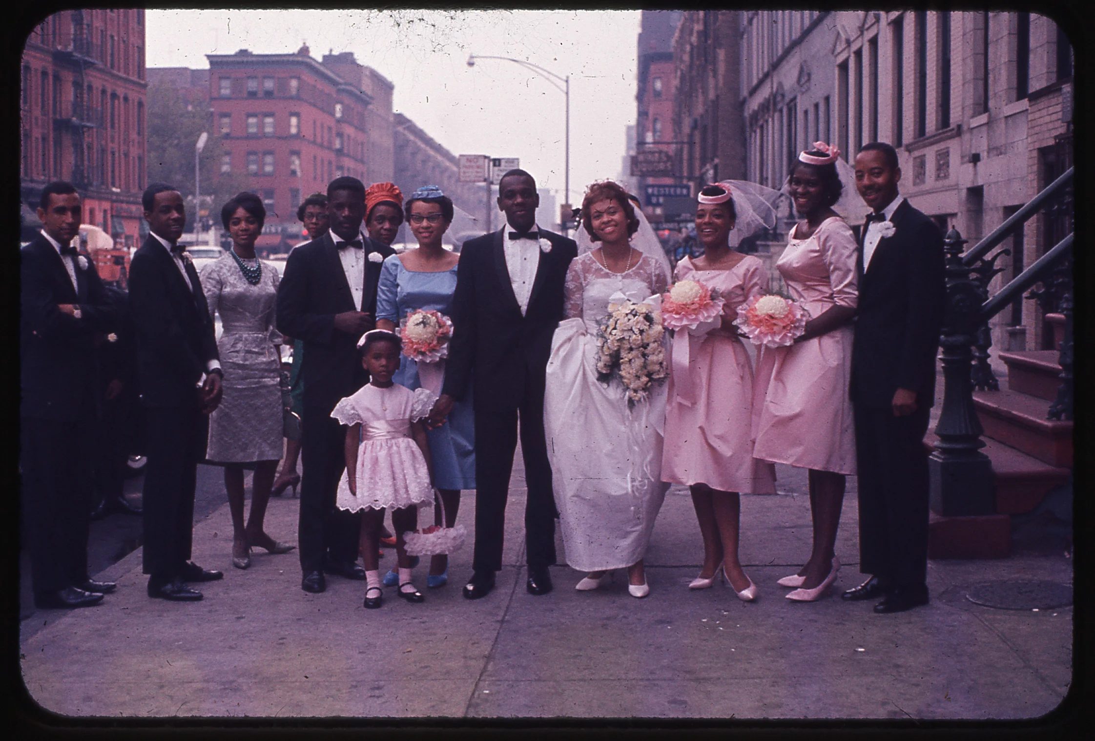 Thomas Allen Harris' parents wedding party on Lenox Avenue, Harlem, USA. Photograph taken by his grandfather Albert Sidney Johnson, c. September 1961