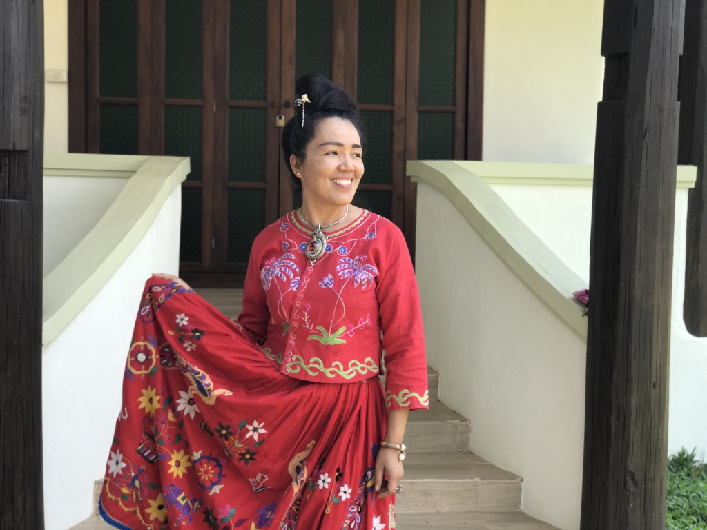 Sarisa, an incredible Thai designer and a personal fashion icon of mine. Sarisa is training a younger generation of Thai and hill tribe women in fashion design and traditional embroidery. She is the scarlet Thai Flower.
