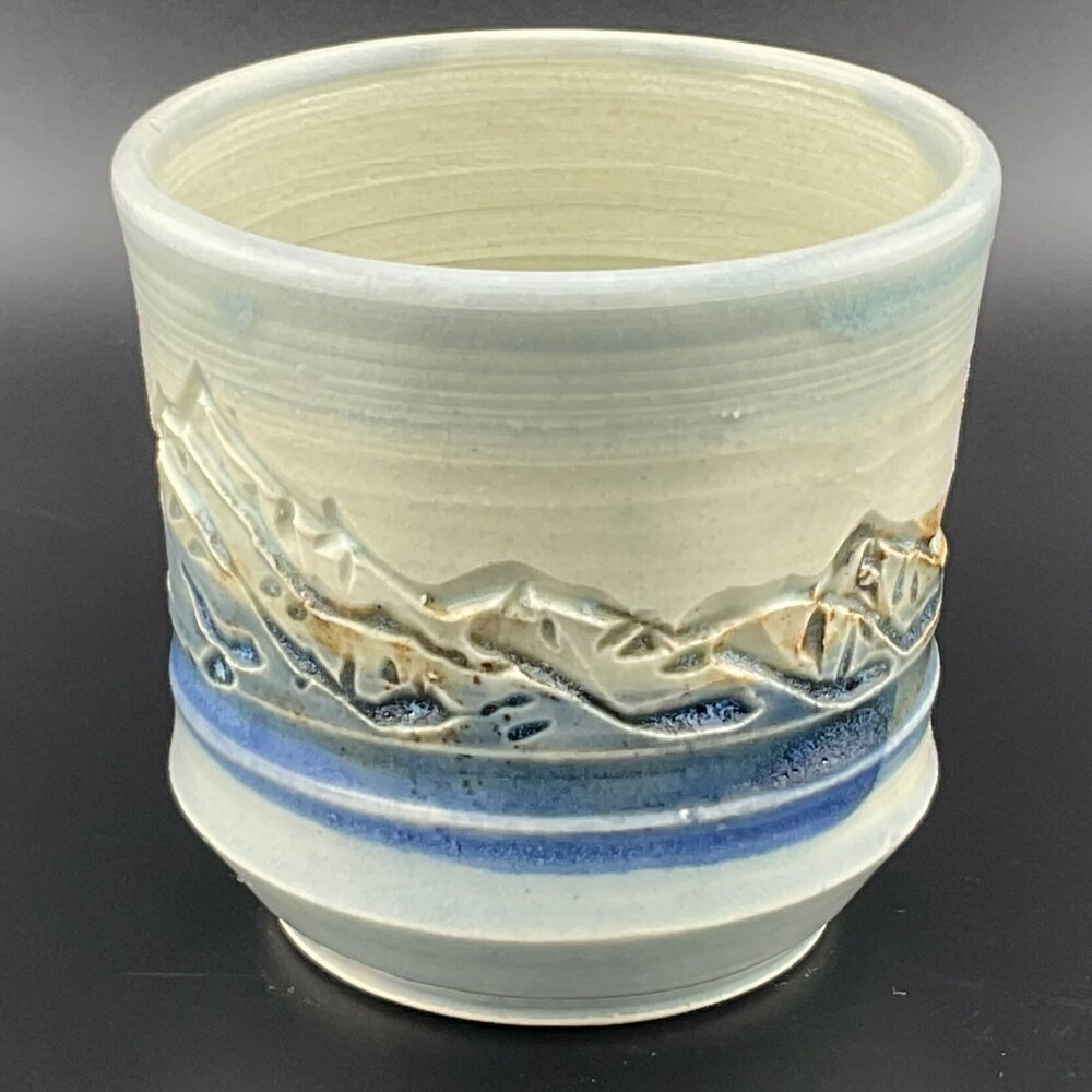 Tranquil Landscape Ceramic Cup: Mountains, Water, and Sky