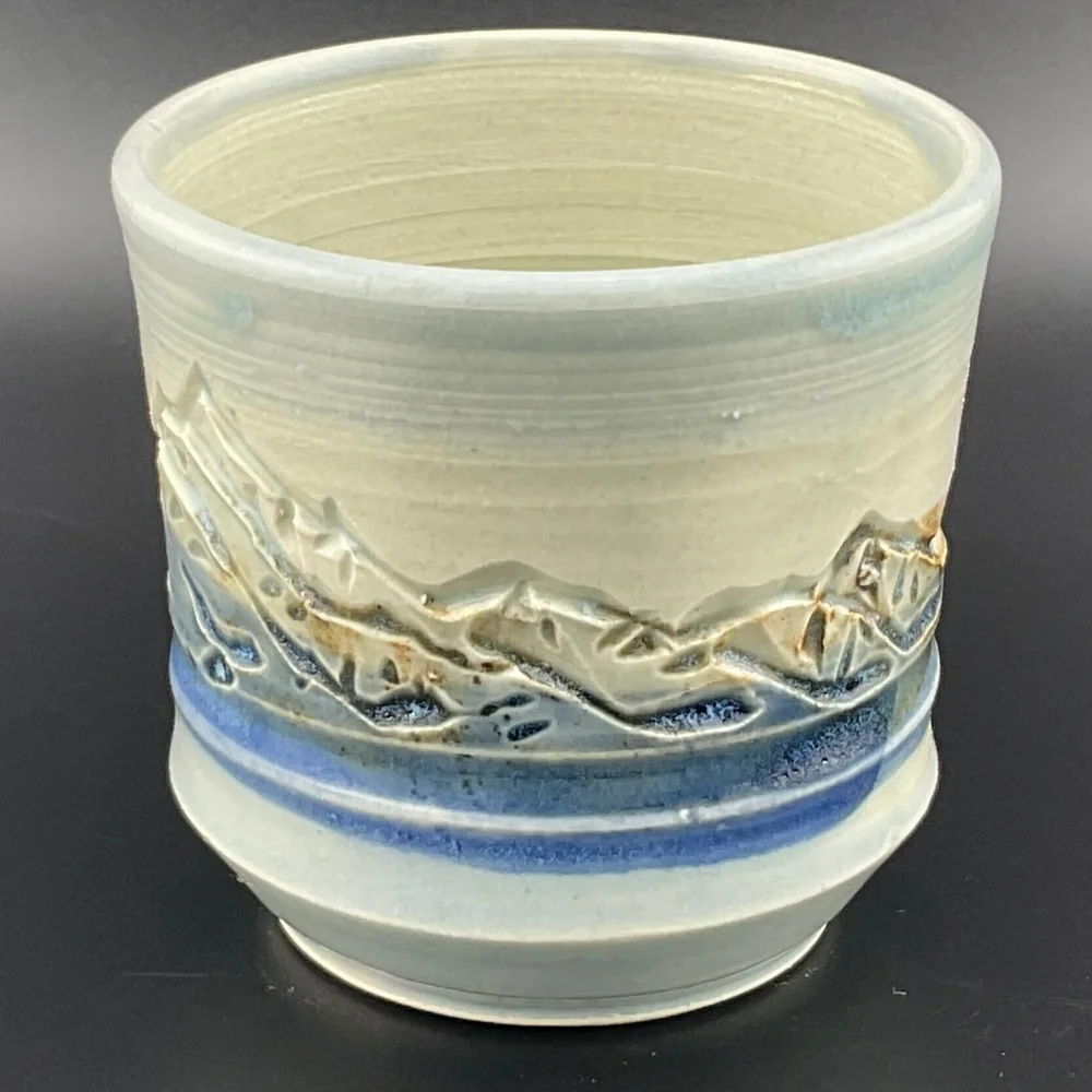 Tranquil Landscape Ceramic Cup: Mountains, Water, and Sky