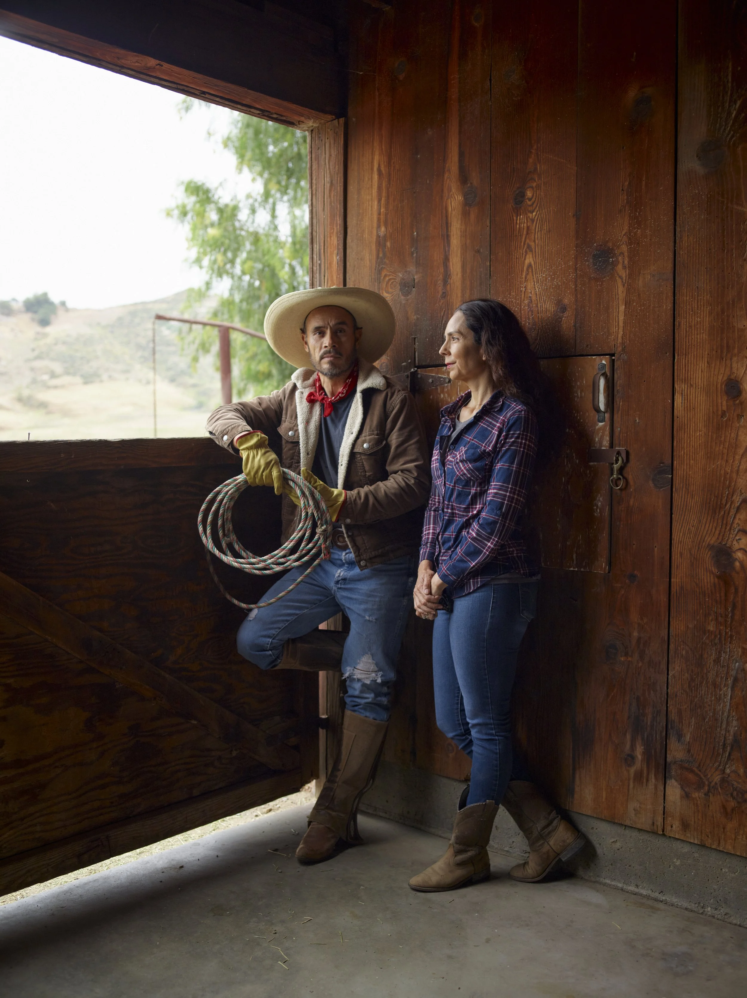 Ernesto and Ana Carlos, standing in the barn of their two-acre property that the family refused to sell to warehouse developers. 
