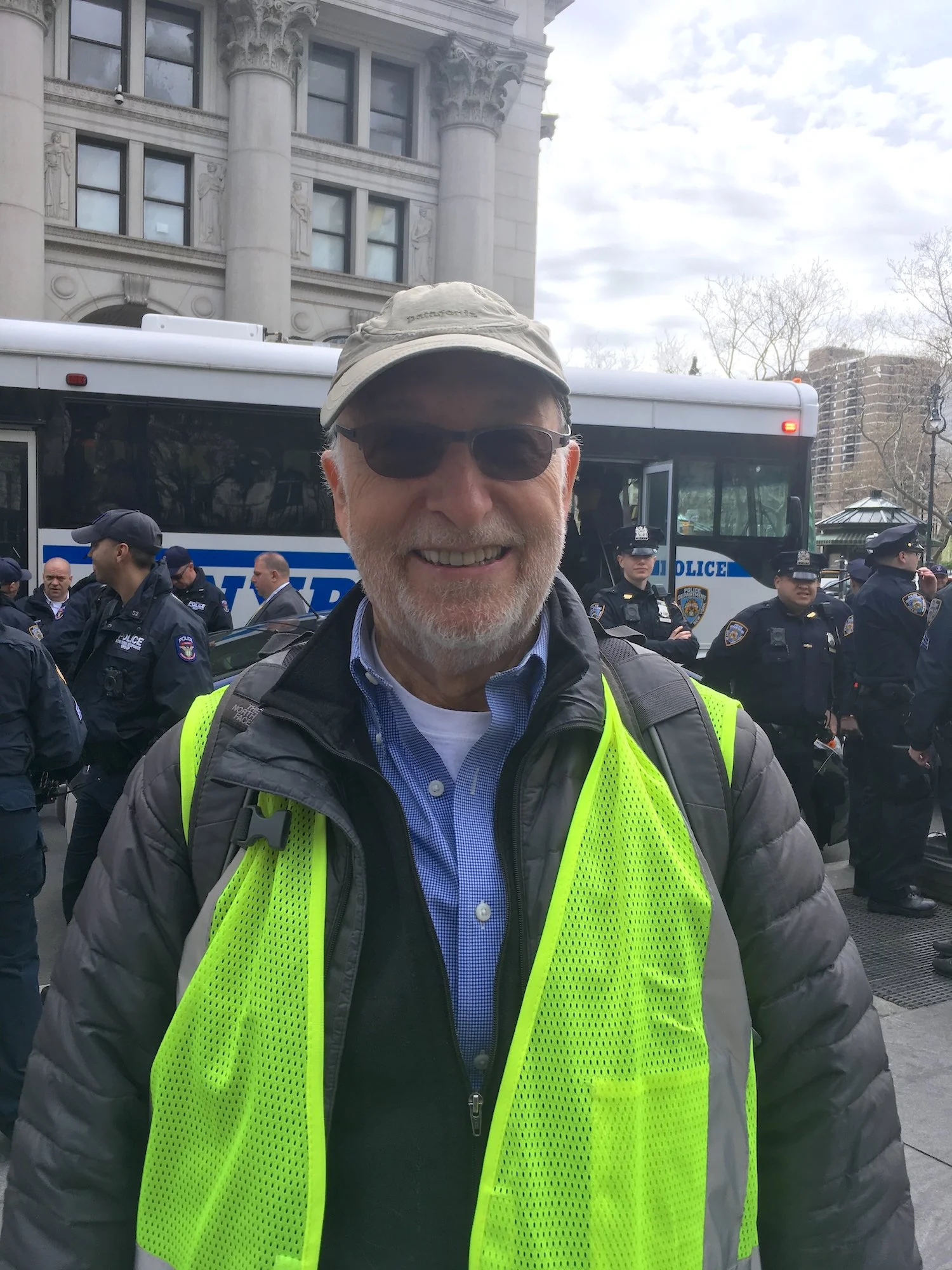 Bob Kolodny, a Marshall with Extinction Rebellion, in front of the arrestees bus, City Hall