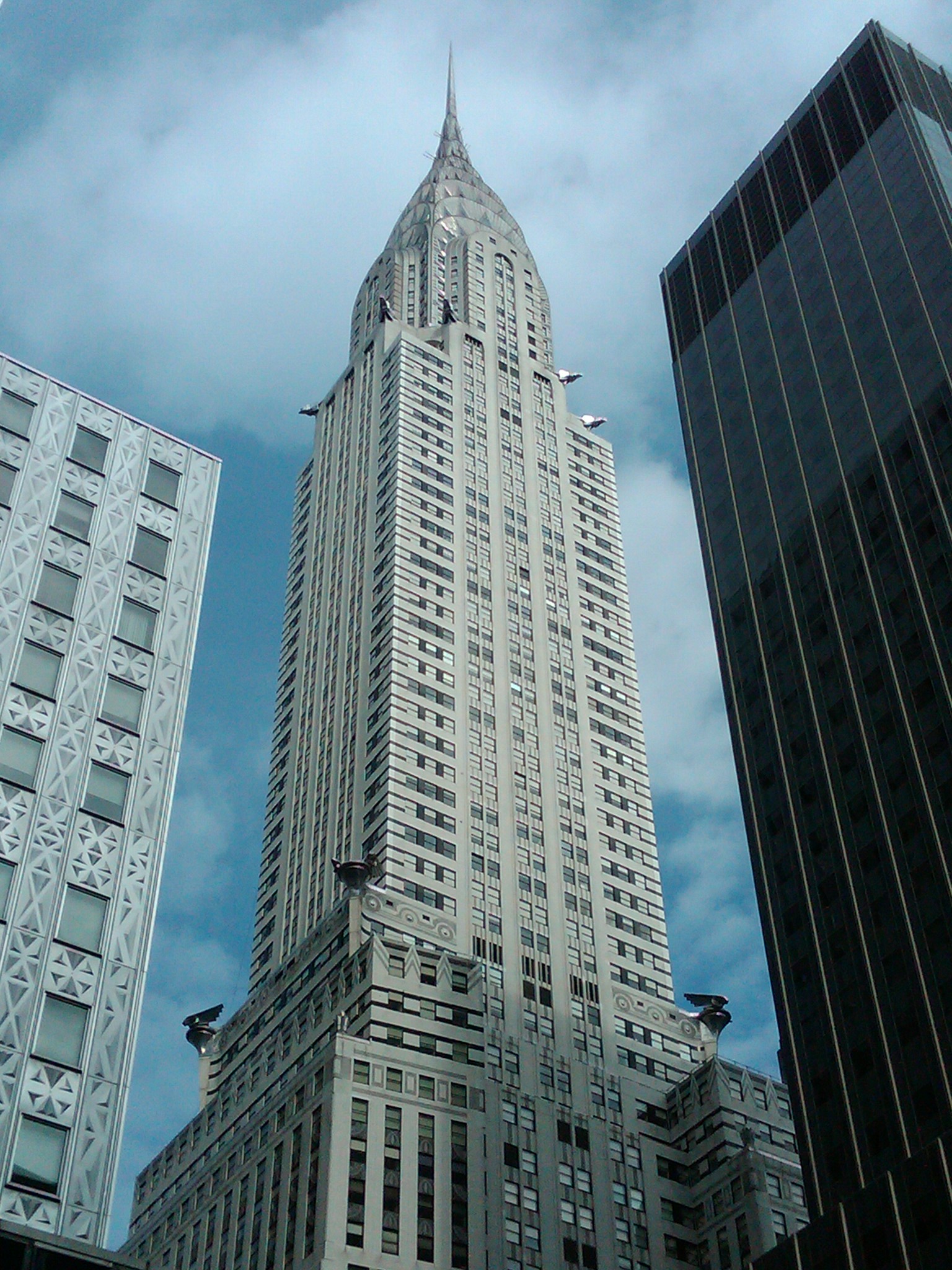 The Chrysler Building as seen from the street. As the building gets taller it has to set itself further back from the street creating the iconic stepped form. 