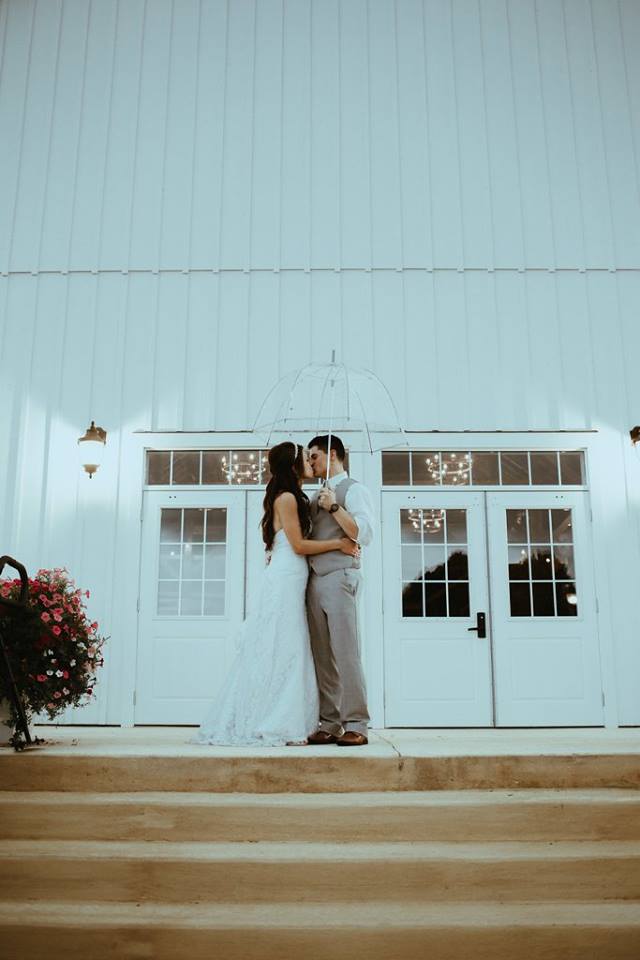 kylie on steps with umbrella.jpg