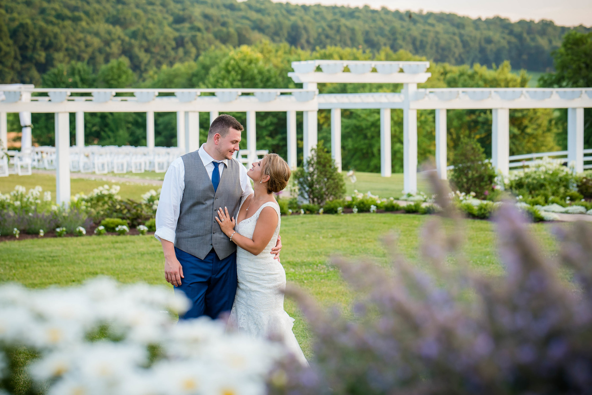 bride and groom with pergola in back.jpg