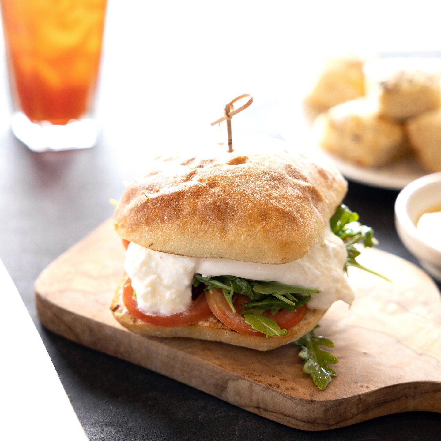 Burrata &amp; Tomato &bull; Local burrata, arugula, Roma tomato, and balsamic aioli hand-pressed on house-baked focaccia bread
Available on our lunch menu daily until 4pm