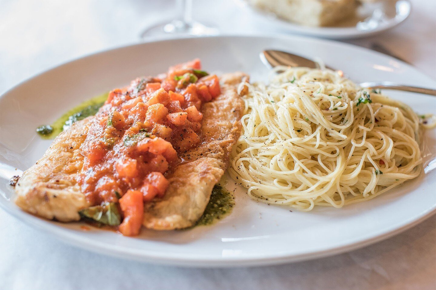 Sea Bass &bull; Pan seared sea bass, pepperonata, pesto sauce, angel hair aglio olio