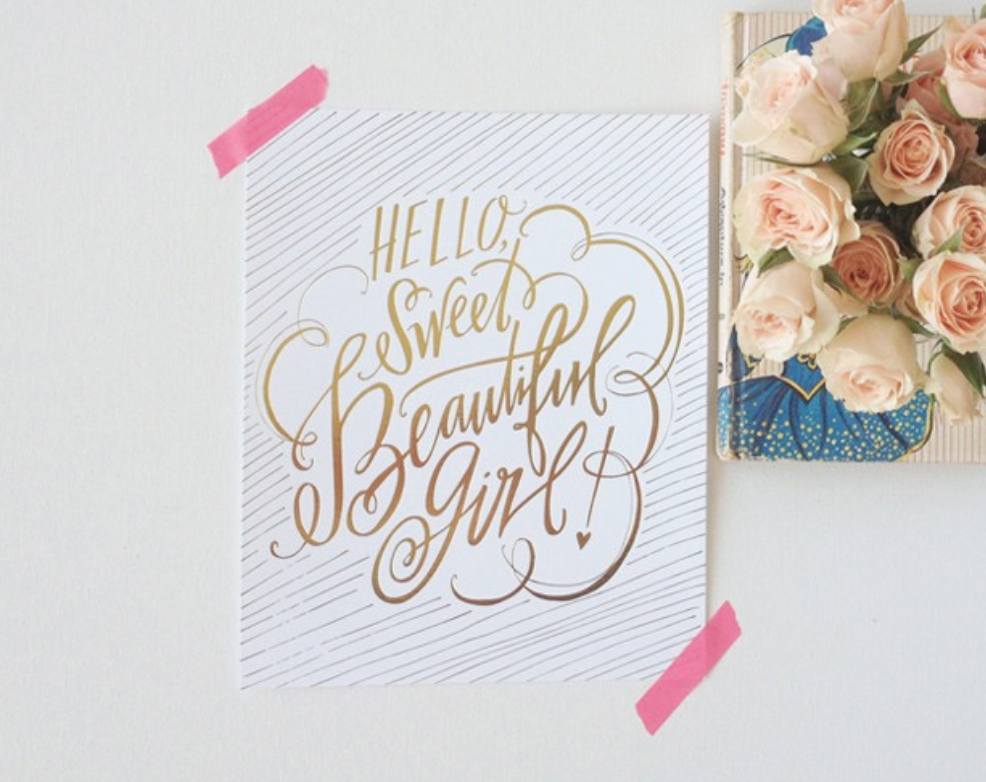 by Lindsay Letters. Lindsay has opted for a more diagonal composition which leads your eye from the top left of the piece to the bottom right and she's used cloud-like embellishments to pull the piece together in a circular composition.