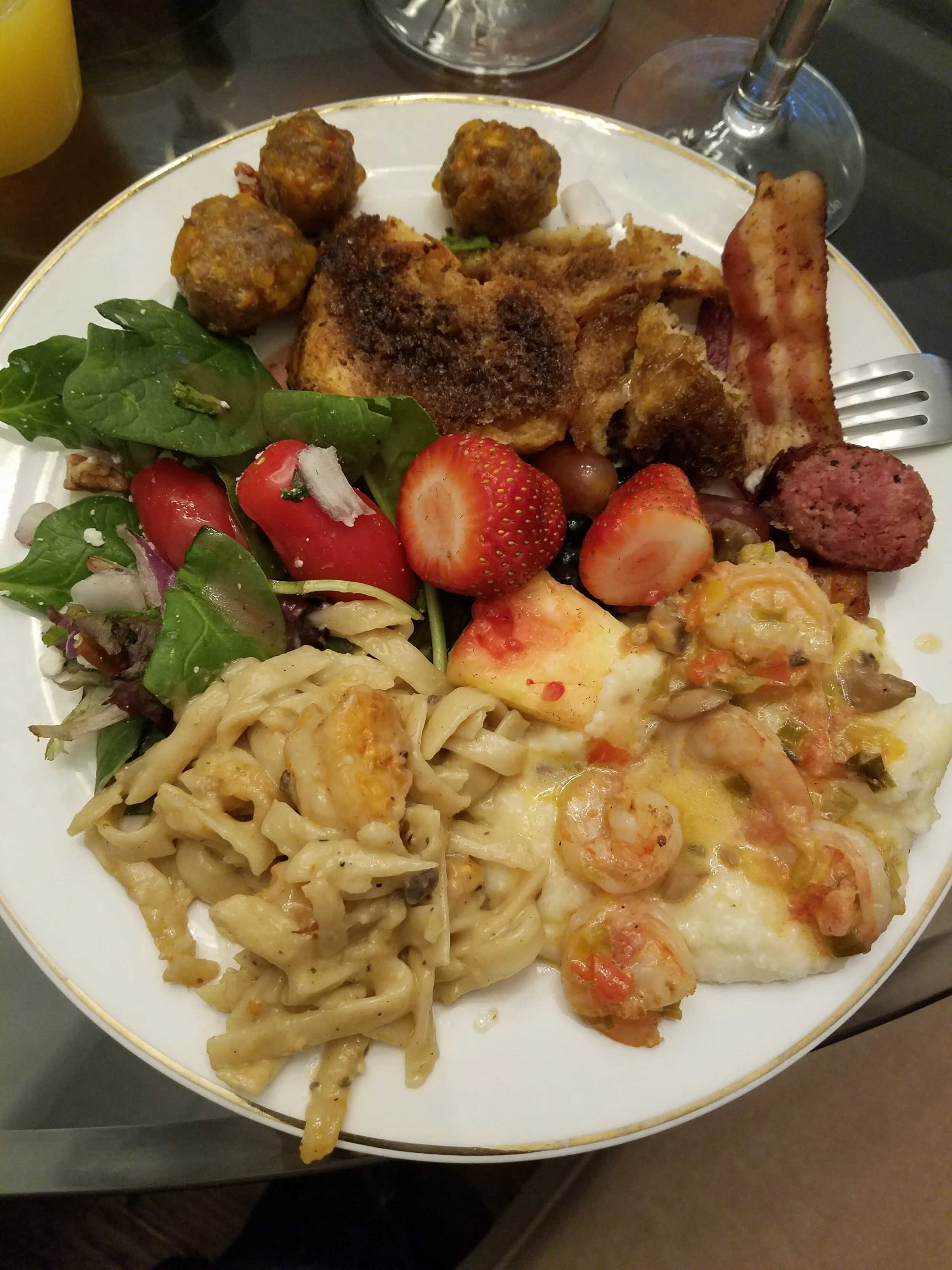 Brunch served on gold-rimmed china.