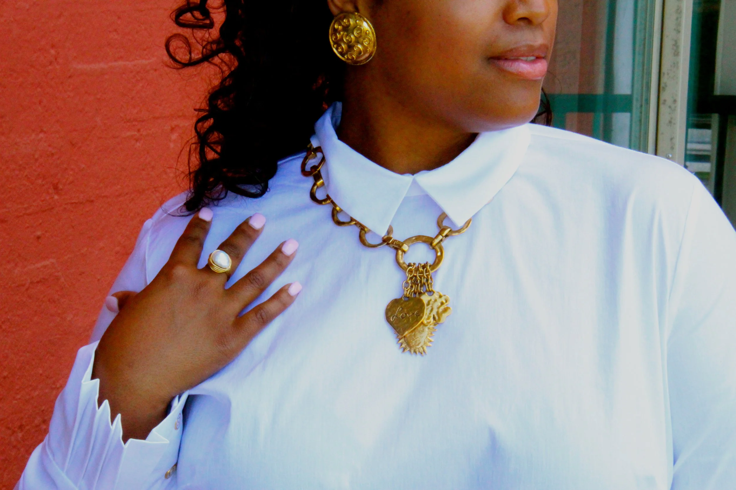 Need a classic brunch look? Pair a crisp white shirt with a vintage gold necklace and earrings and a hand-made oversized freshwater pearl ring . White also goes great with an abalone and fresh water pearl stunner paired with lovely dominica green earrings pictured below. 