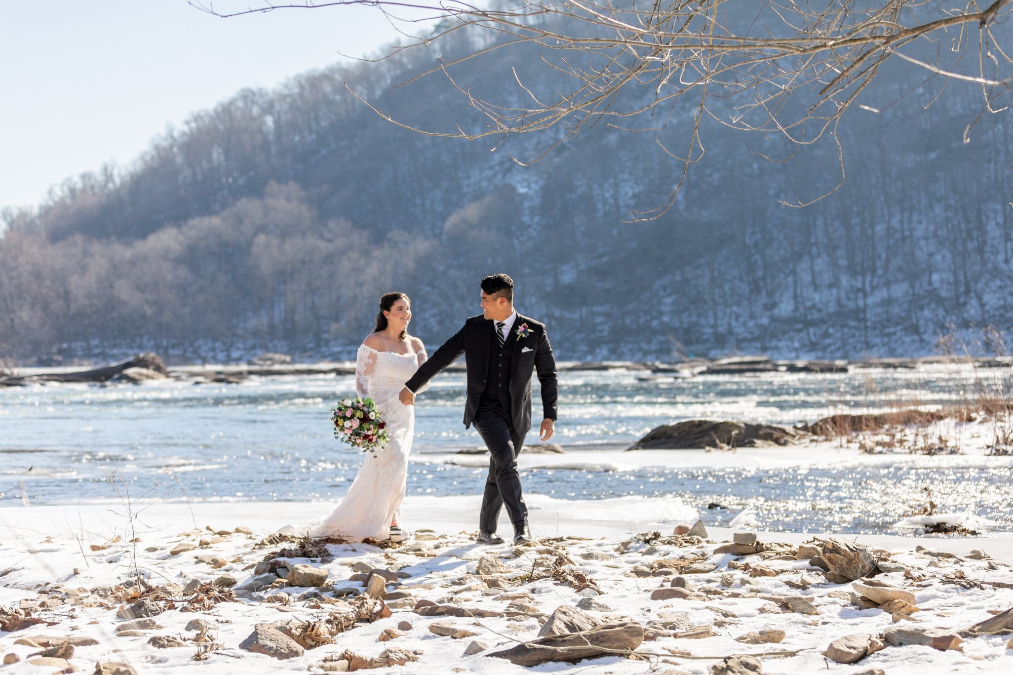 Couple on their wedding day on the potomac river in harpers ferry, west virginia