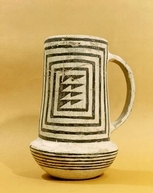 A black-on-white pitcher. The geometric design can be traced back to earlier basketry. Country of Origin: USA. Culture: Anasazi, Pueblo period. Date/Period: c. 1000 AD. Material Size: h = 20 cms. Credit Line: Werner Forman Archive/ Maxwell Museum of Anthropology, Albuquerque, NM. Location: 05. Photo Credit: HIP / Art Resource, NY Image Reference: AR9147066
