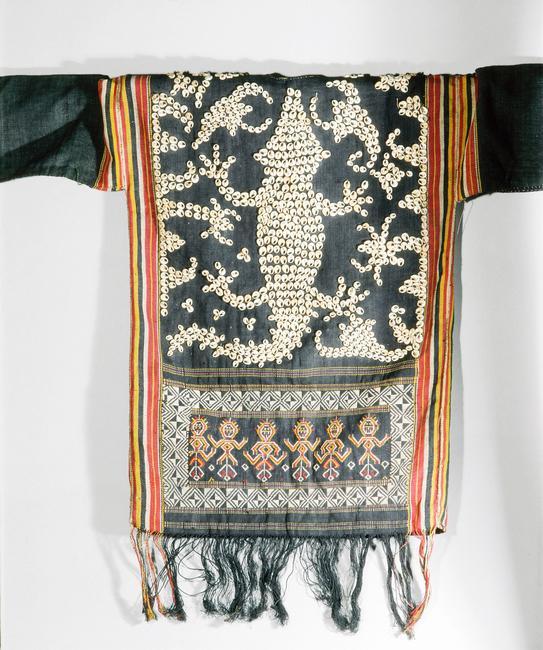 Cut-shell decorated jacket worn by Apo Kayan people at ceremonies connected with agriculture, warfare, and the commemoration of the dead. Back view showing image of lizard or crocodile. Country of Origin: Indonesia/ Sarawak. Culture: Apo Kayan Date/Period: 20th C. Place of Origin: Borneo. Material Size: Cotton and shell. Credit Line: Werner Forman Archive/ British Museum, London. Location: 05. Photo Credit: HIP / Art Resource, NY Image Reference: AR9131438