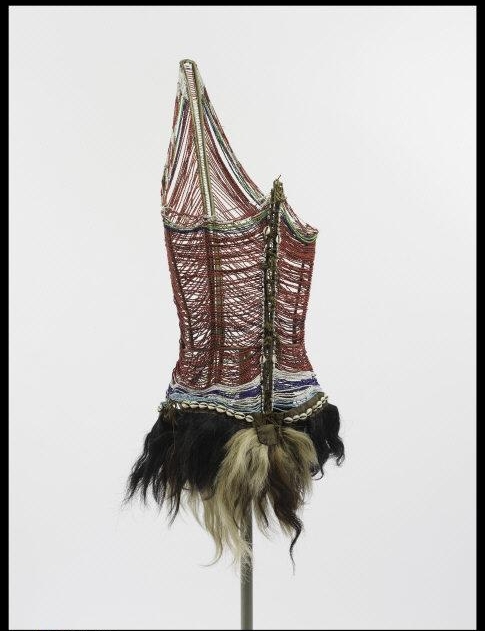 Men's Beaded Bodice. African (Dinka peoples), mid-20th century. Glass beads, animal skins, wood, cowry shells. Other: 43 1/2 x 8 x 20 1/2 in. (110.5 x 20.3 x 52.1 cm). Isabel Shults Fund, 2001 (2001.177) Location: The Metropolitan Museum of Art, New York, NY, U.S.A. Photo Credit: Image copyright © The Metropolitan Museum of Art. Image source: Art Resource, NY Image Reference: ART519739