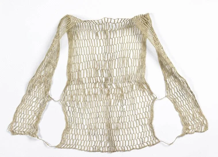 Sweat protector (koyori ase-hajiki). 1850-1860. Medium: paper; Technique: 4-strand plaiting with 2-strand twists. H x W: 62.2 x 52 cm (24 1/2 x 20 1/2 in.). Vest which opens at the front; fronts connected to back by two strands. Plaited recycled paper forming hexagonal mesh. Twisted strands are knotted at the bottom and middle of each side. Museum purchase from General Acquisitions Endowment Fund. 2009-36-2. Photo: Matt Flynn © Smithsonian Institution Location: Cooper-Hewitt, National Design Museum, New York, NY, U.S.A. Photo Credit: Cooper Hewitt, Smithsonian Design Museum / Art Resource, NY Image Reference: ART484268