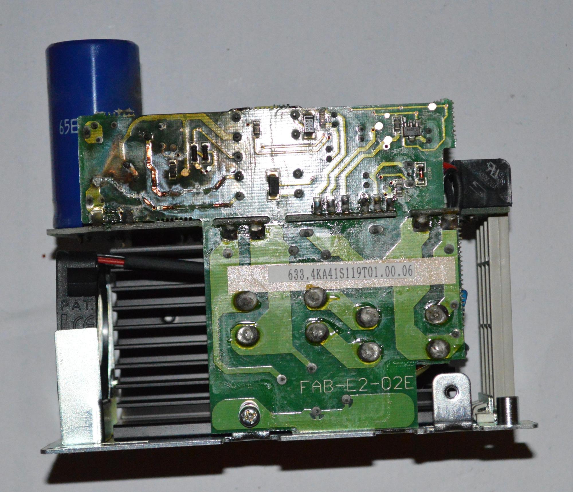 The circuit board is clearly damaged by the heat from some kind of component failure.