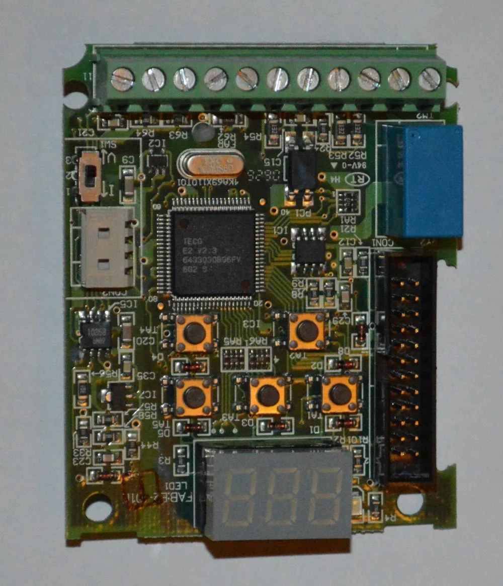 Controller board. Th e TQFP packaged chip is the controller. The screw terminals at the top are available for connection of external I/O. The blue component to the top right is a relay used for digital output.