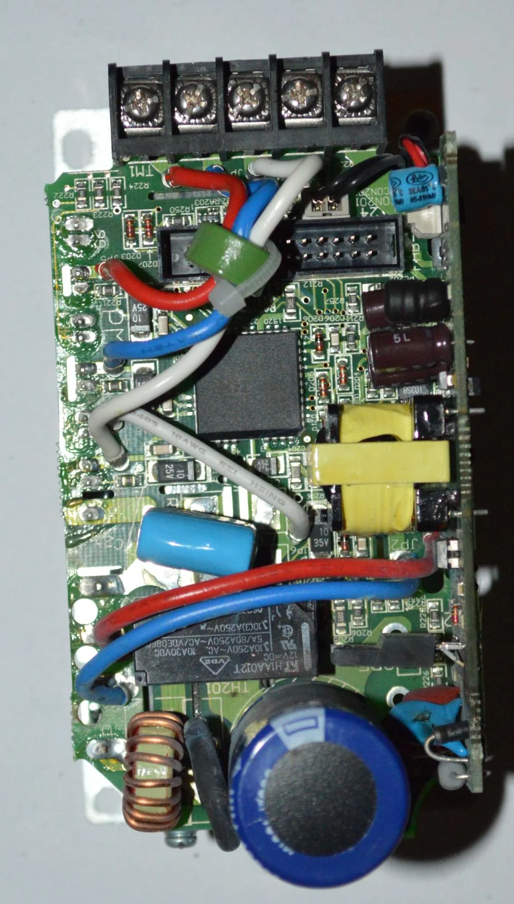  The IDC connector at the top is used to interface with the controller board. The PLCC chip located below the connector is the gate driver to the IGBT module. The relay next to the reservoir capacitor is used to bypass the inrush limiting resistor. 