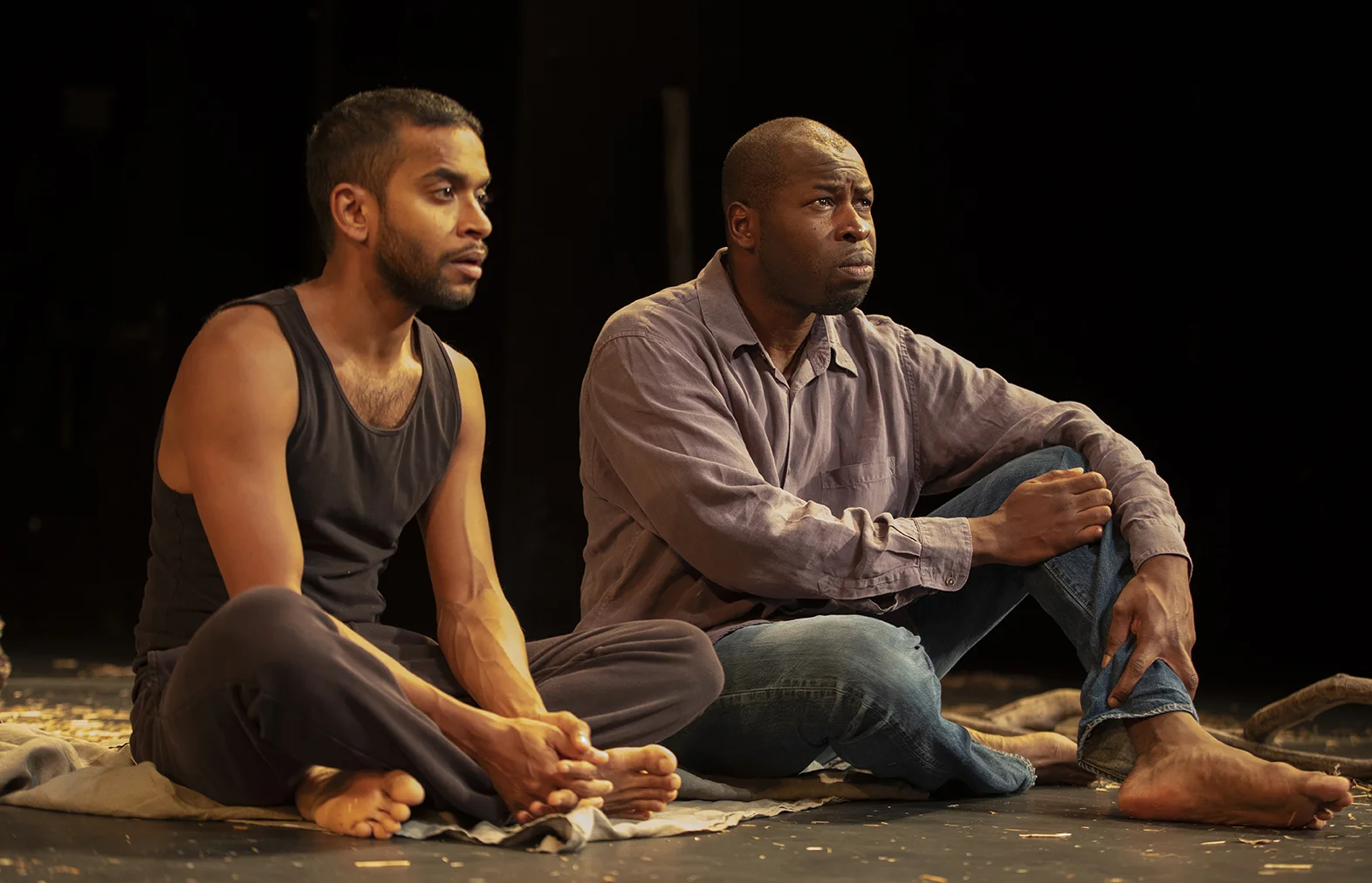 DECEMBER Hiran Abeysekera as Mavuso & Hervé Goffings as Ezekiel in Peter Brook’s The Prisoner at the Theatre for a New Audience in New York. Photographer: Joan Marcus.