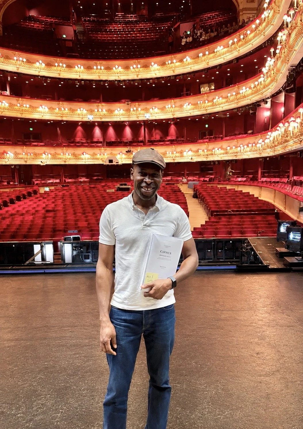 Hervé Goffings at the Royal Opera House holding a score of Bizet’s Carmen during the 2024 production.