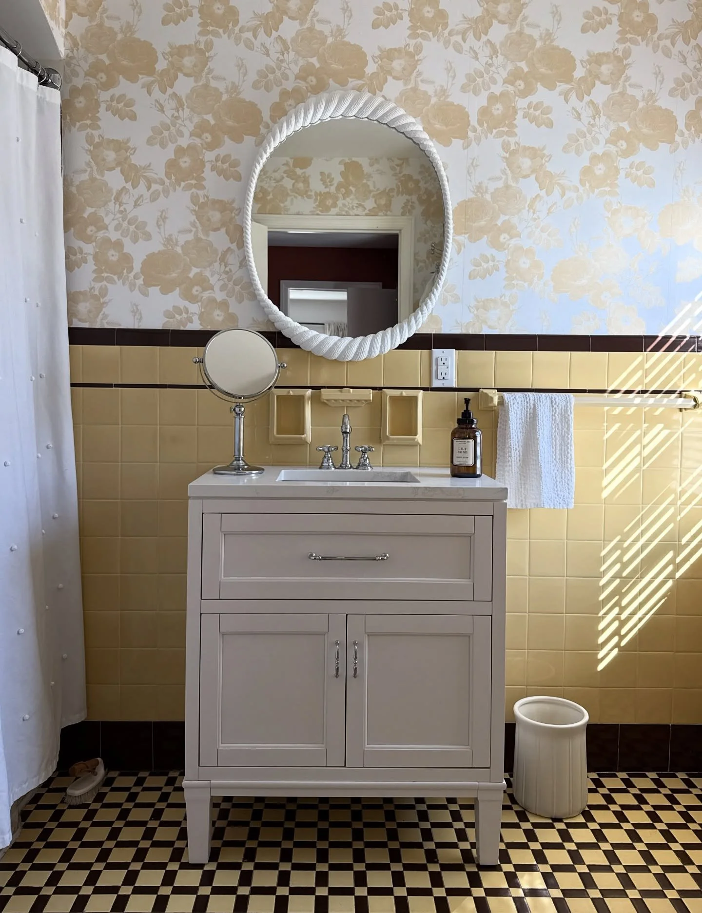 We decided to embrace the yellow with this no-demo-reno of our hallway bath. A new vanity, mirror, and most importantly, the addition of this yellow @lovevsdesign wallpaper made all the difference. Swipe for the before. 🌼 

Wallpaper: Botanical Blis