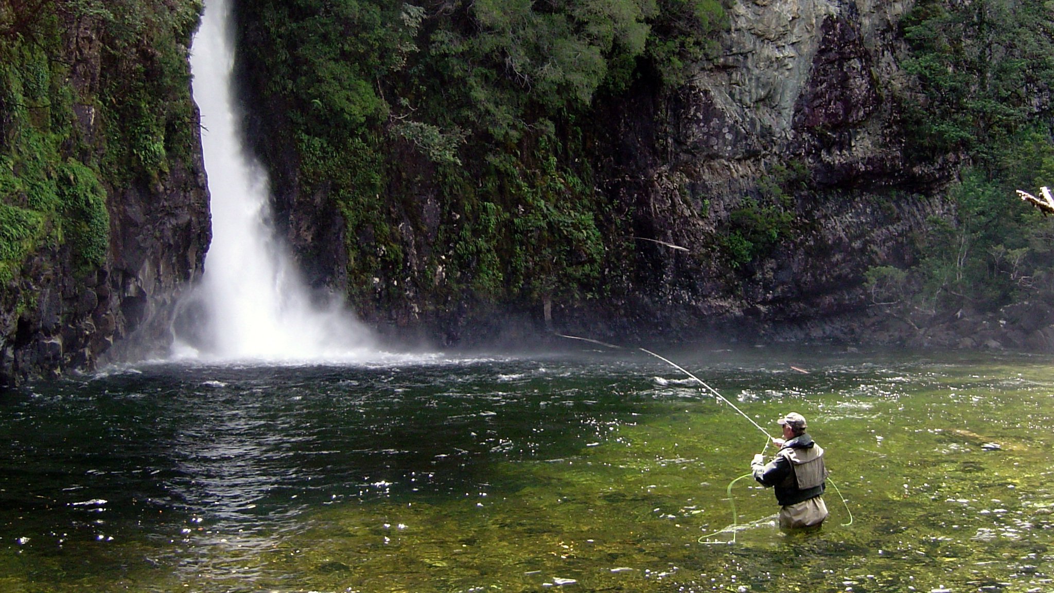 Fisherman+with+waterfall+in+background.jpg