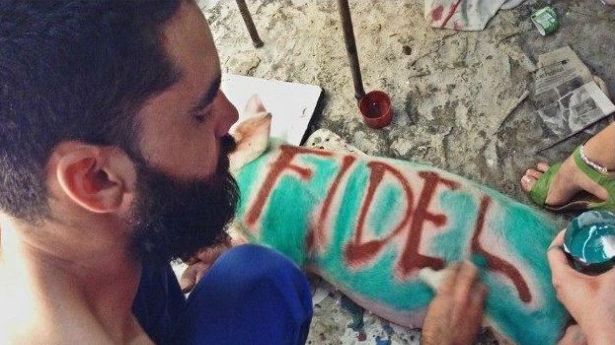 'El Sexto' spent ten months in prison for painting the names 'Fidel' and 'Raul' on two pigs / Credit: @AmnestyOnline