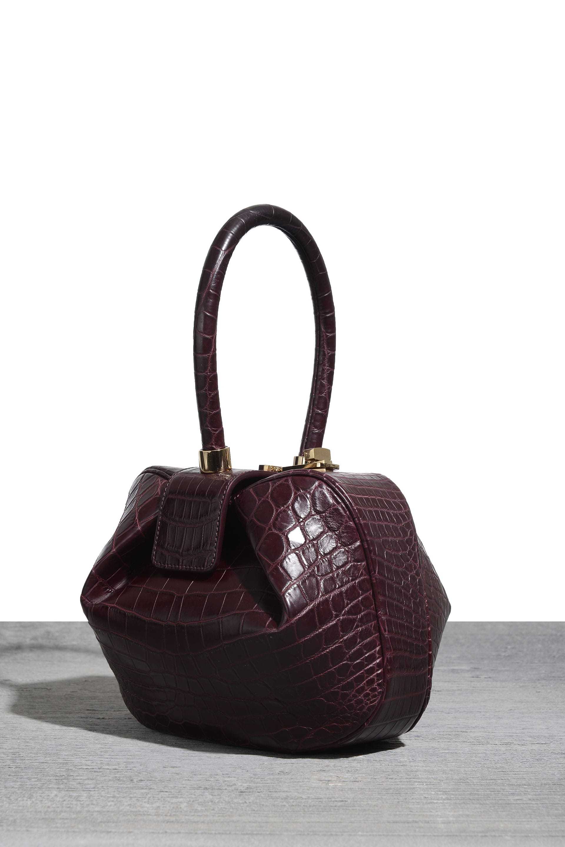 Nina bag in burgundy croc, $16,000, at Bergdorf Goodman and Net-a-Porter
